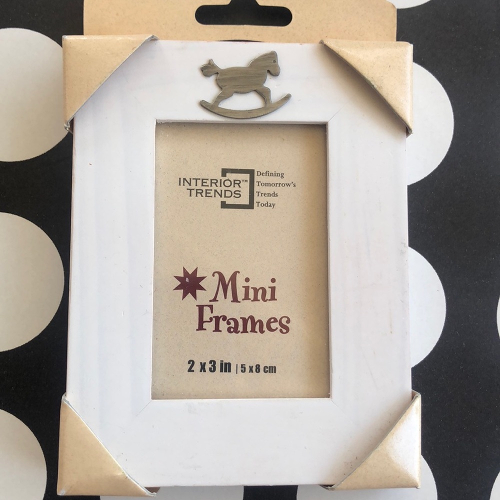 Picture frame wood with a metal rocking horse